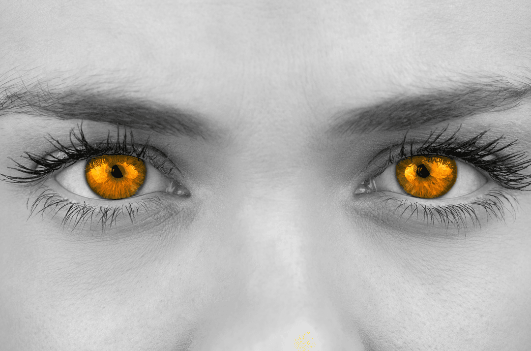 Striking Female with Transparent Bright Orange Eyes Close-Up