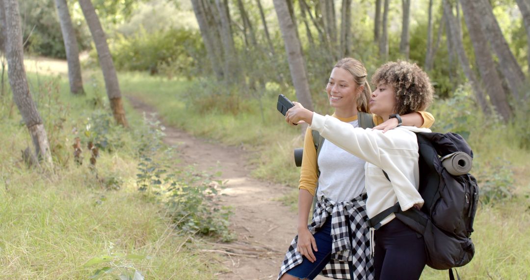 Friends Exploring Forest Path on Outdoor Adventure