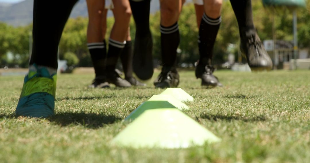 Soccer Players Dribbling Through Cones During Practice - Free Images, Stock Photos and Pictures on Pikwizard.com