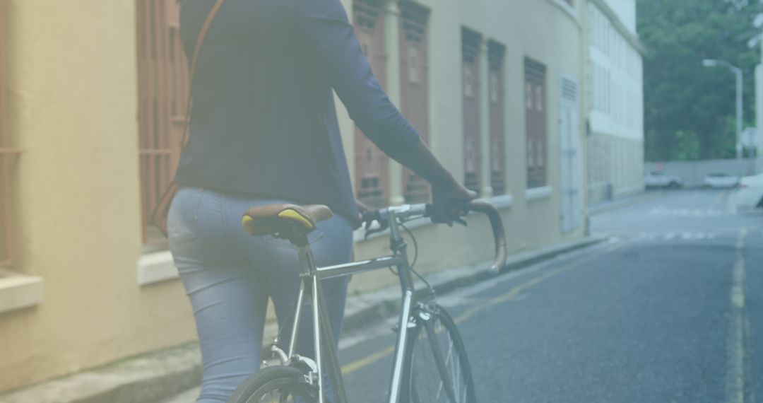 Woman Walking Bicycle in Urban Area with Light Spots Effect