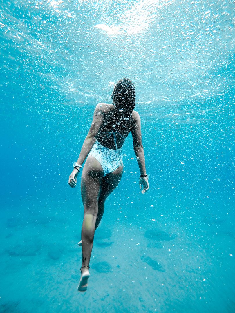 Woman Swimming Underwater in Clear Blue Ocean - Free Images, Stock Photos and Pictures on Pikwizard.com