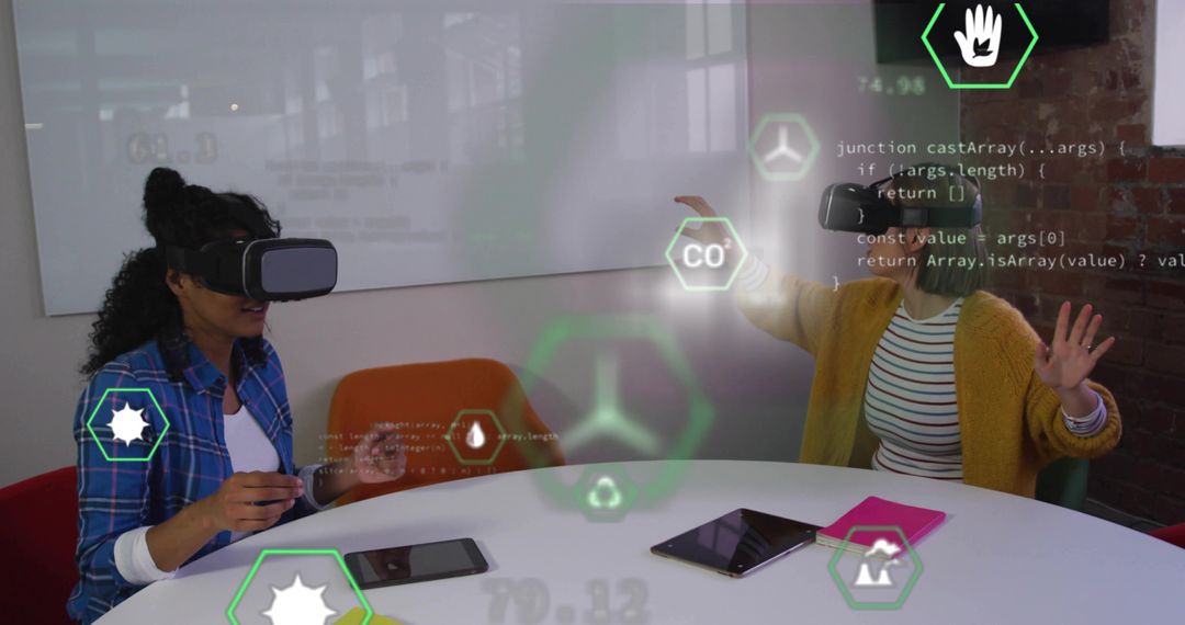 Women Using VR Headsets with Holographic Icons in Modern Office