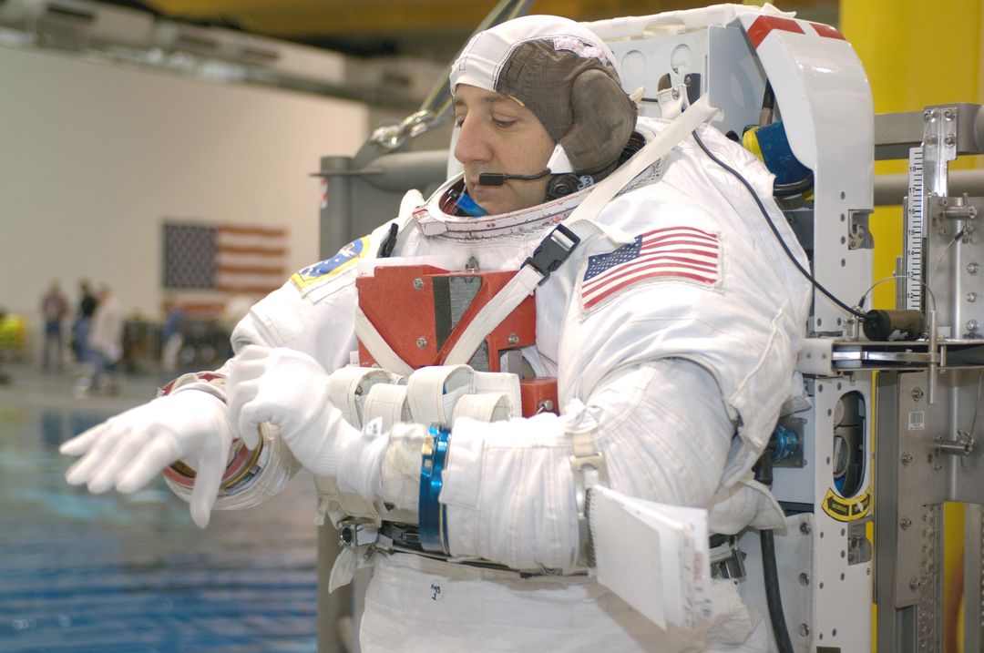 Astronaut Preparing for Neutral Buoyancy Training in EMU Spacesuit - Free Images, Stock Photos and Pictures on Pikwizard.com