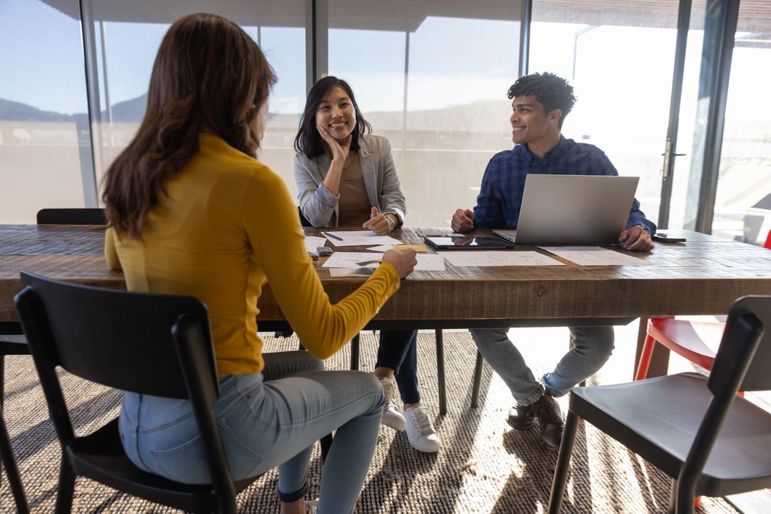 Diverse Team Discussing Strategy in Modern Conference Room