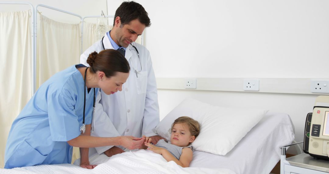 Doctors Attending to Young Patient in Hospital Room - Free Images, Stock Photos and Pictures on Pikwizard.com