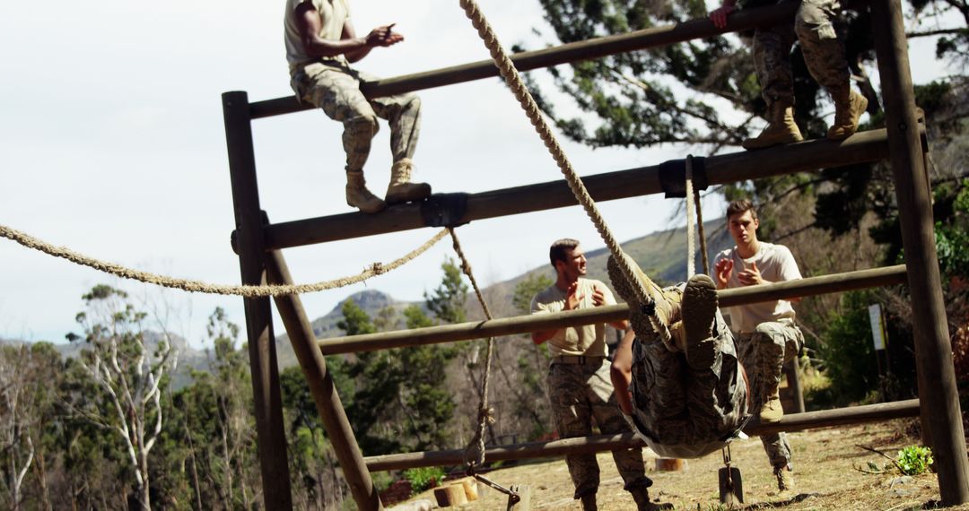 Soldiers Navigating Outdoor Obstacle Course in Military Training