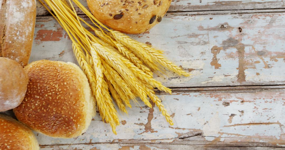 Freshly Baked Bread with Wheat Ears on Rustic Wooden Table - Free Images, Stock Photos and Pictures on Pikwizard.com