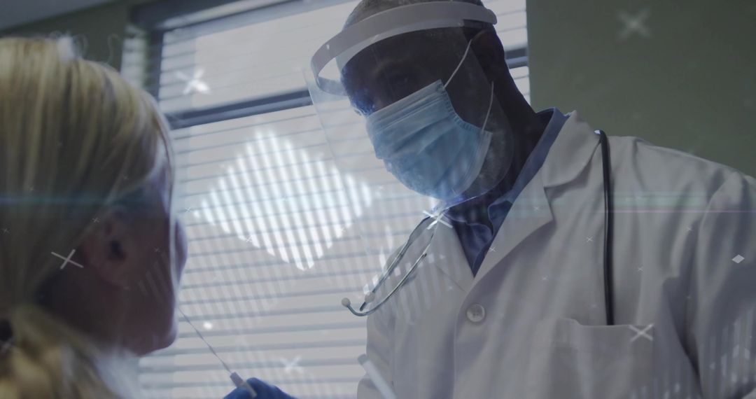 Doctor Administering COVID-19 Test in Clinical Setting with Face Shield