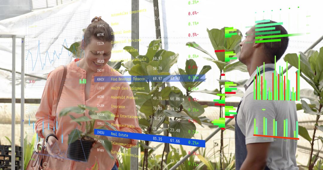 Nursery worker inspecting plants with visitor using augmented reality analytics overlays in greenhou
