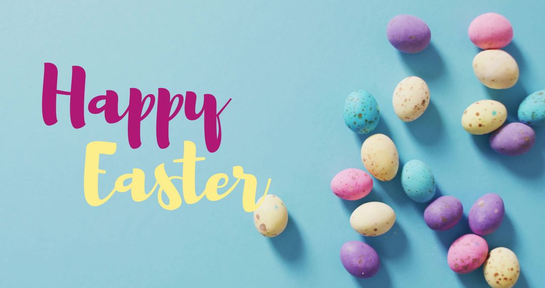 Vibrant Easter Eggshells on Aqua Background with Festive Greeting