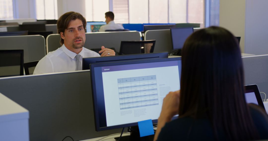 Caucasian Executives Communicating in Modern Open Office