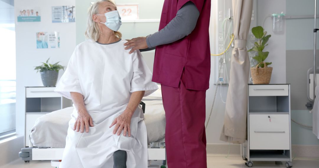 Nurse consulting elderly patient in hospital room - Free Images, Stock Photos and Pictures on Pikwizard.com