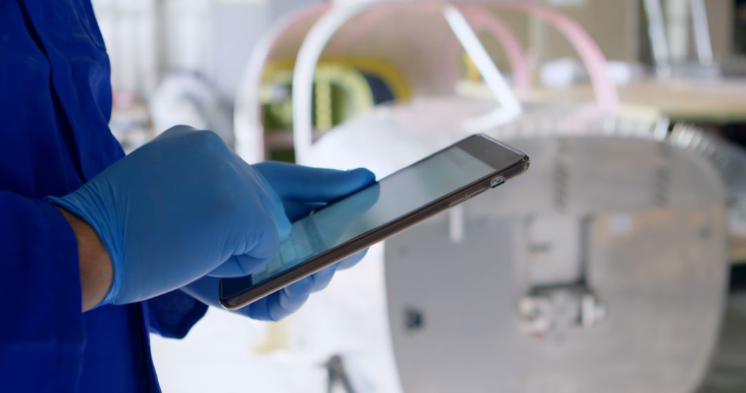 Technician Using Tablet in Industrial Facility - Free Images, Stock Photos and Pictures on Pikwizard.com