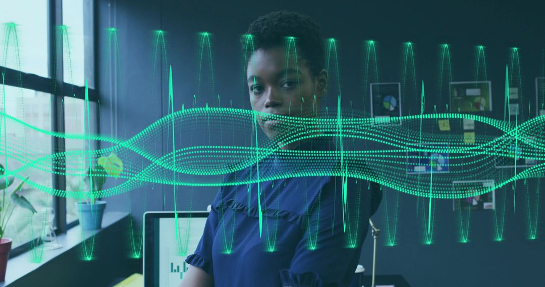 African American Professional Analyzing Digital Data with Waveforms Visualization