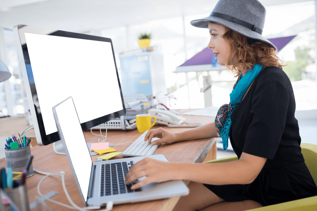 Modern office professional working at laptop with transparent display