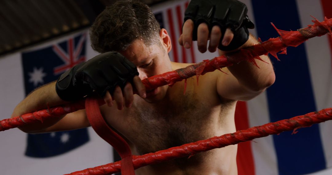 Exhausted Boxer Leaning on Ropes After Training - Free Images, Stock Photos and Pictures on Pikwizard.com