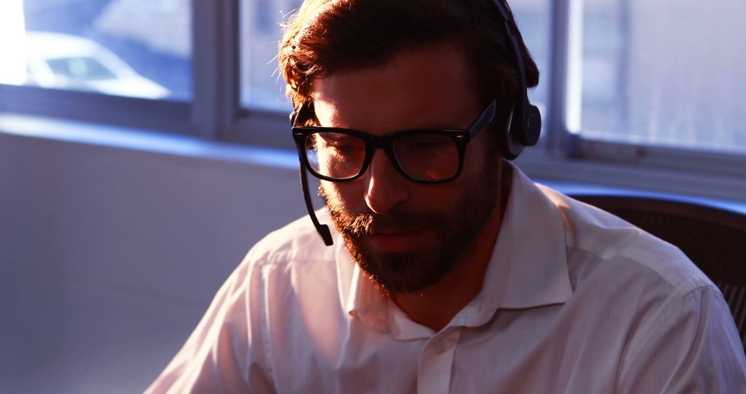 Customer Support Representative Wearing Headset in Office - Free Images, Stock Photos and Pictures on Pikwizard.com