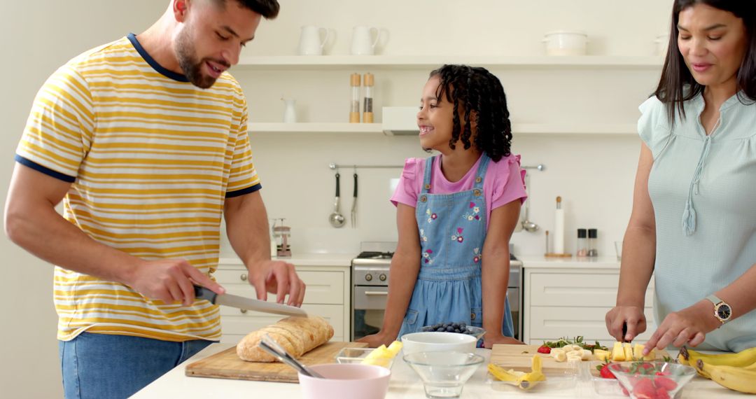 Diverse Family Enjoying Cooking Together in Modern Kitchen