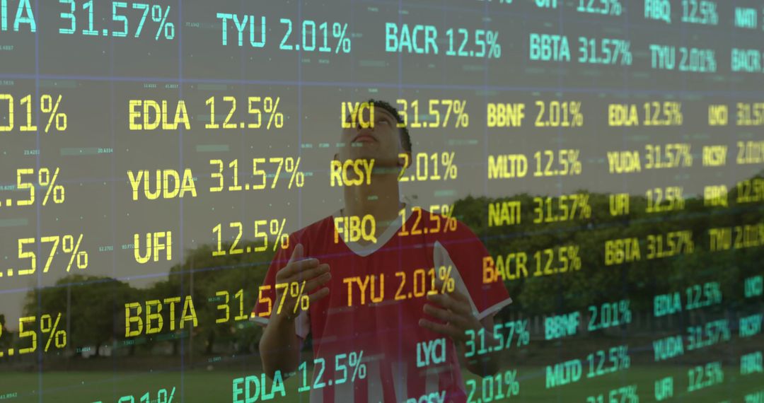 Athlete Celebrating on Field with Stock Ticker Overlay, Double Exposure Concept