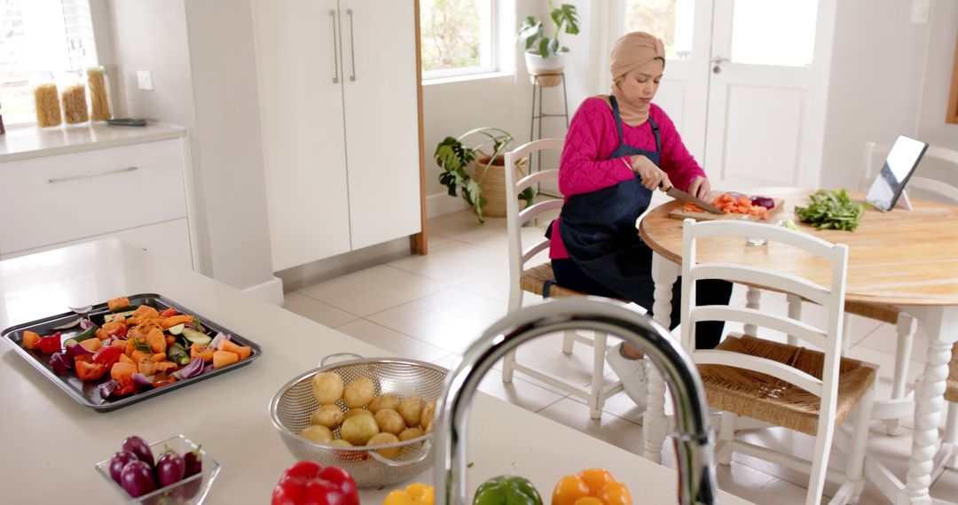 Woman Preparing Meal in Modern Kitchen with Fresh Vegetables - Free Images, Stock Photos and Pictures on Pikwizard.com