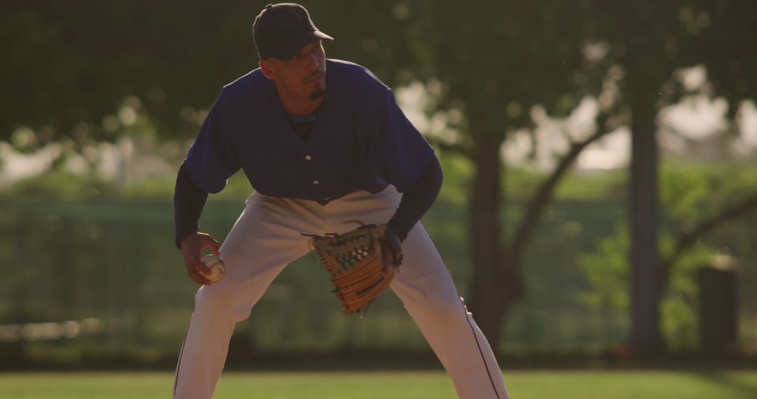 Baseball Player in Ready Position Holding Glove on Field - Free Images, Stock Photos and Pictures on Pikwizard.com