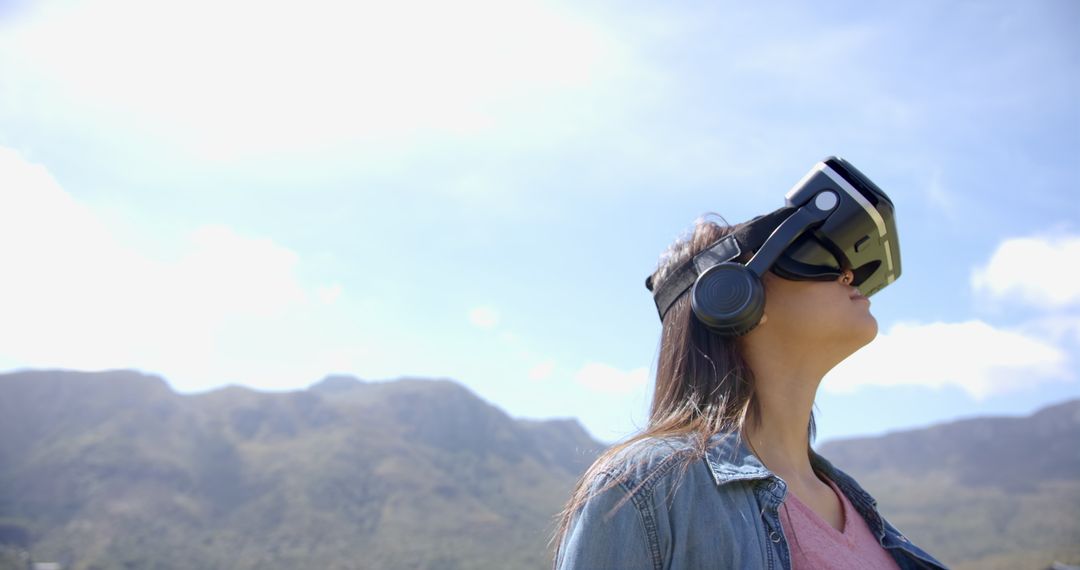 Woman Exploring Virtual Reality with VR Headset Outdoors