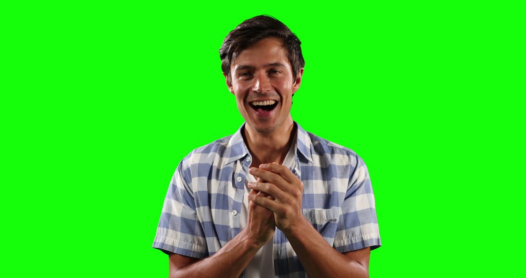 Excited Young Man Clapping in Joyful Moment Isolated on Green Screen - Free Images, Stock Photos and Pictures on Pikwizard.com