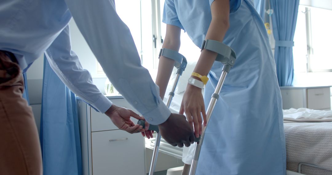 Healthcare Professional Assisting Patient with Crutches