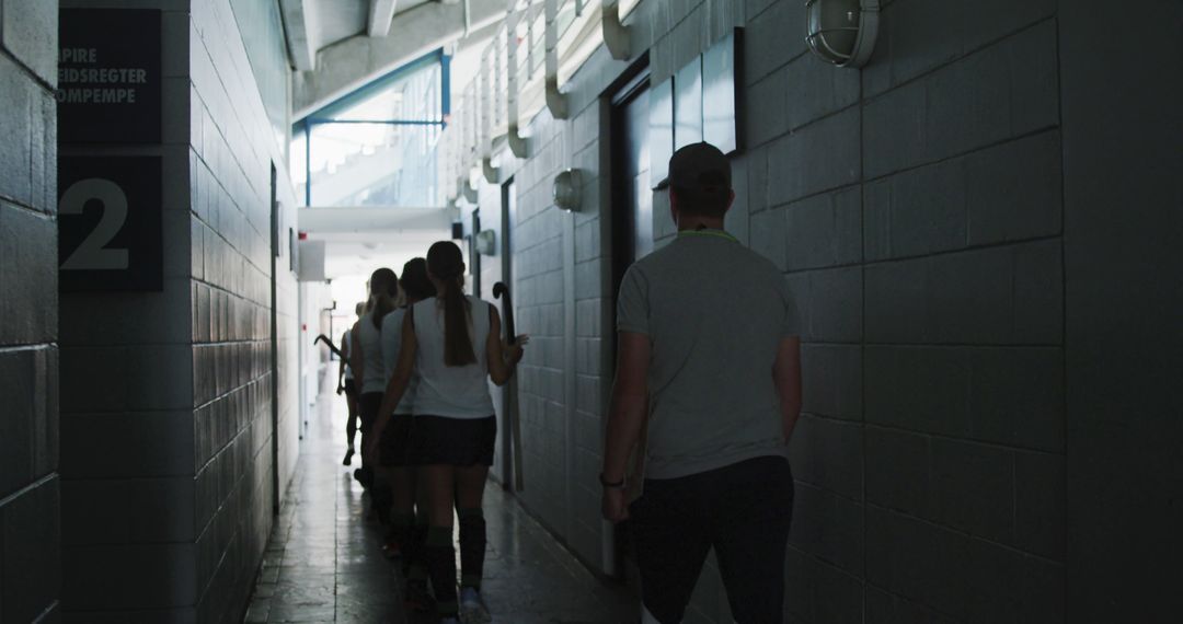 Female Athletes Walking in Sports Facility Corridor - Free Images, Stock Photos and Pictures on Pikwizard.com