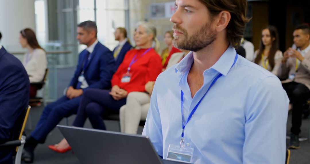 Caucasian Businessman with Laptop Attending Seminar