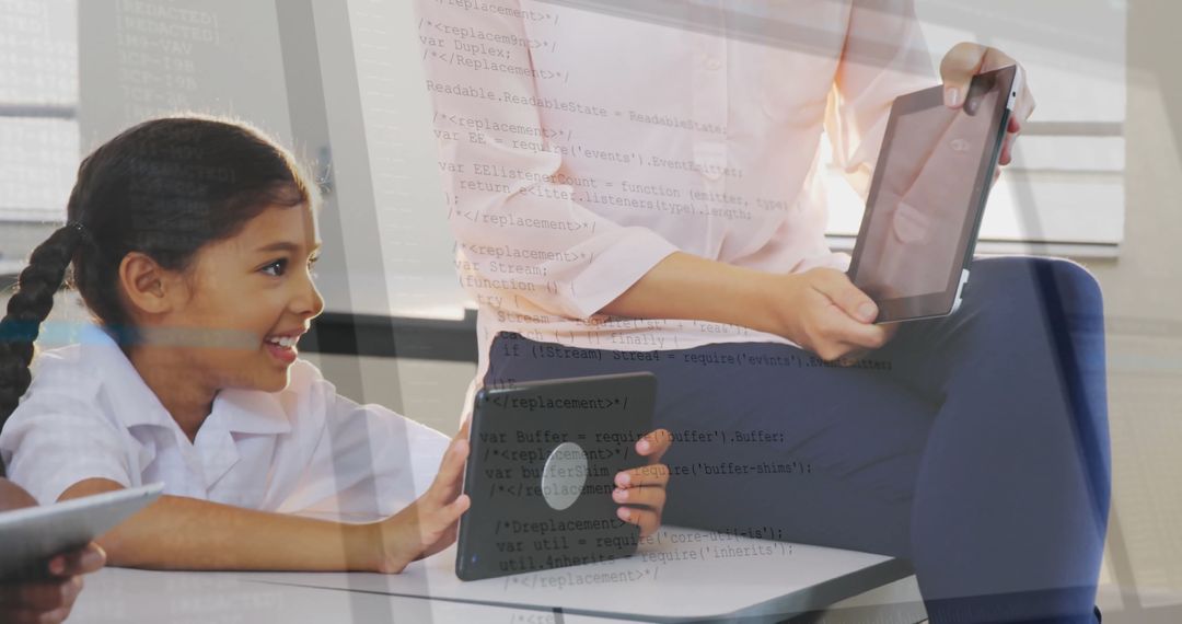 Teacher Mentoring Student with Digital Technology in Classroom