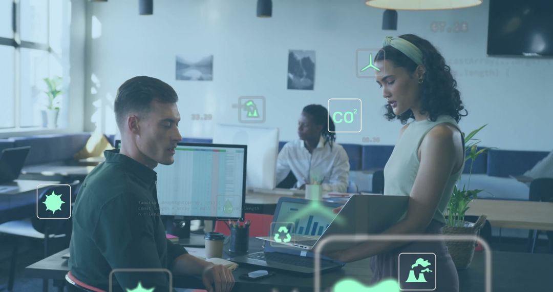 Colleagues Discussing Ecological Data in Modern Office