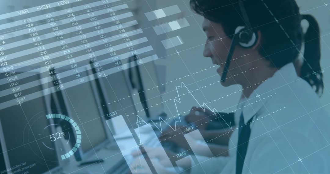 Asian Businessman Analyzing Financial Data with Headset