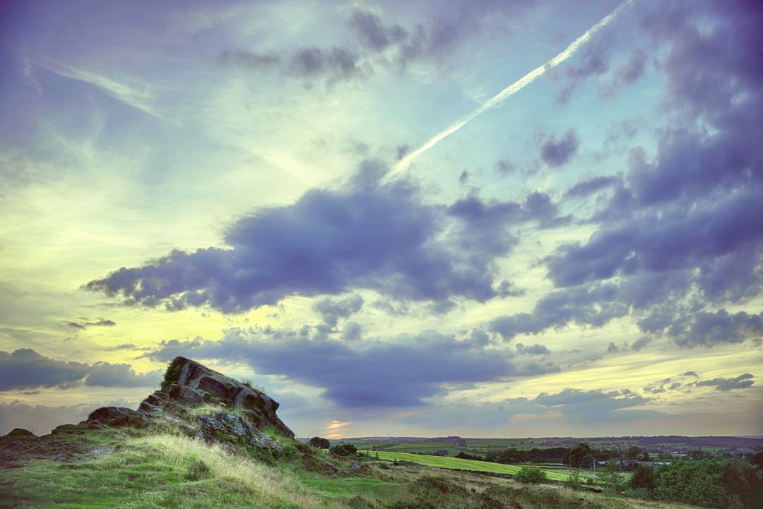 Scenic Landscape with Rocky Hills and Colorful Sunset Sky - Free Images, Stock Photos and Pictures on Pikwizard.com