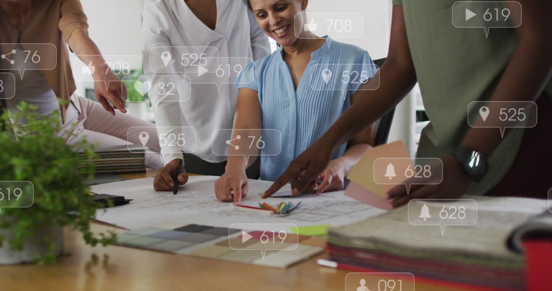 Diverse Team Collaborating on Project With Social Media Icons Overlay