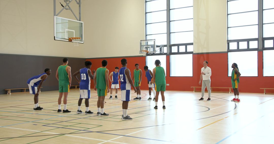 Diverse Male Basketball Players Preparing for a Free Throw with Coach