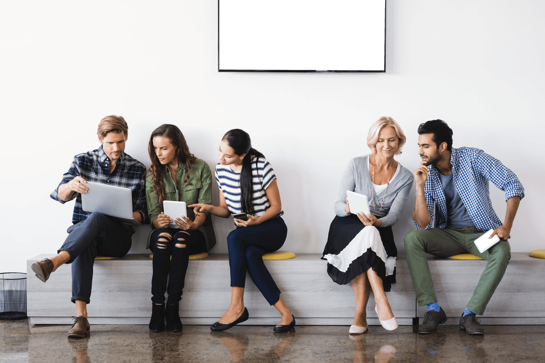 Diverse Professionals Collaborating in Office with Technology