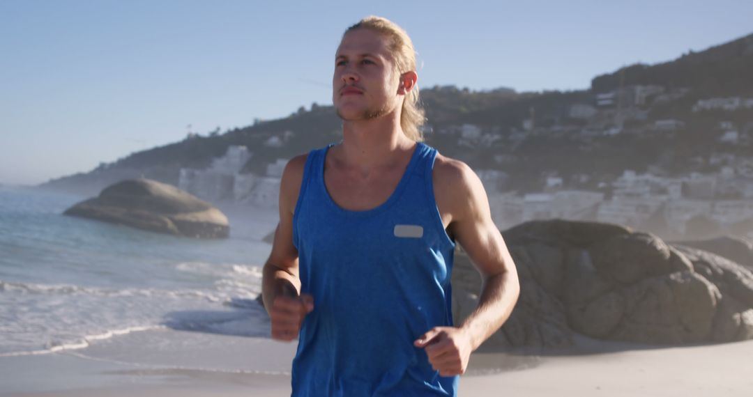 Young Man Jogging on Beach During Sunrise - Free Images, Stock Photos and Pictures on Pikwizard.com