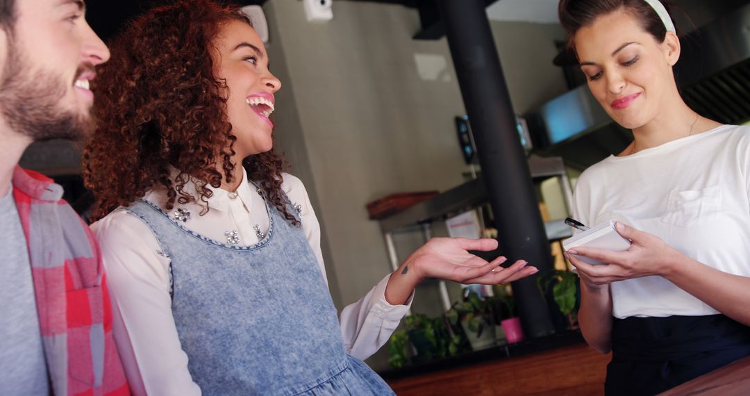 Happy Diners with Waitress in Casual Restaurant