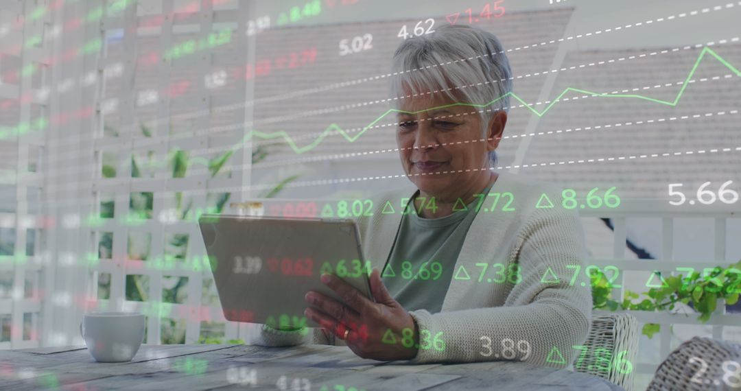 Senior Woman Analyzing Digital Finance Data on Tablet