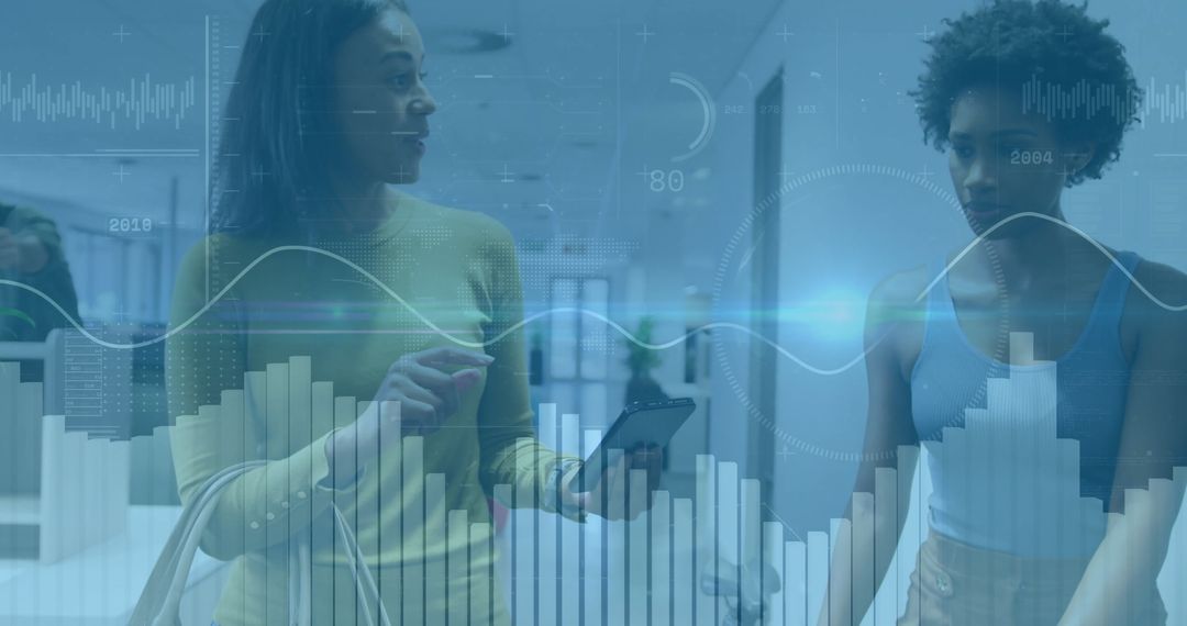 Business Colleagues Discussing Analytics in Modern Office Setting