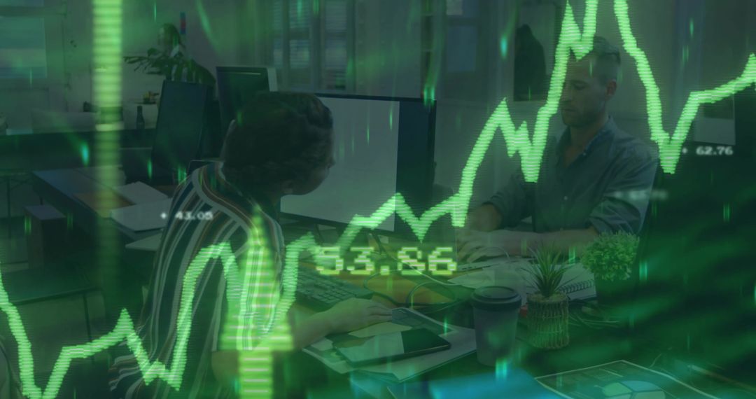 Business team analyzing green stock charts on office monitors, collaborative data analytics dashboar