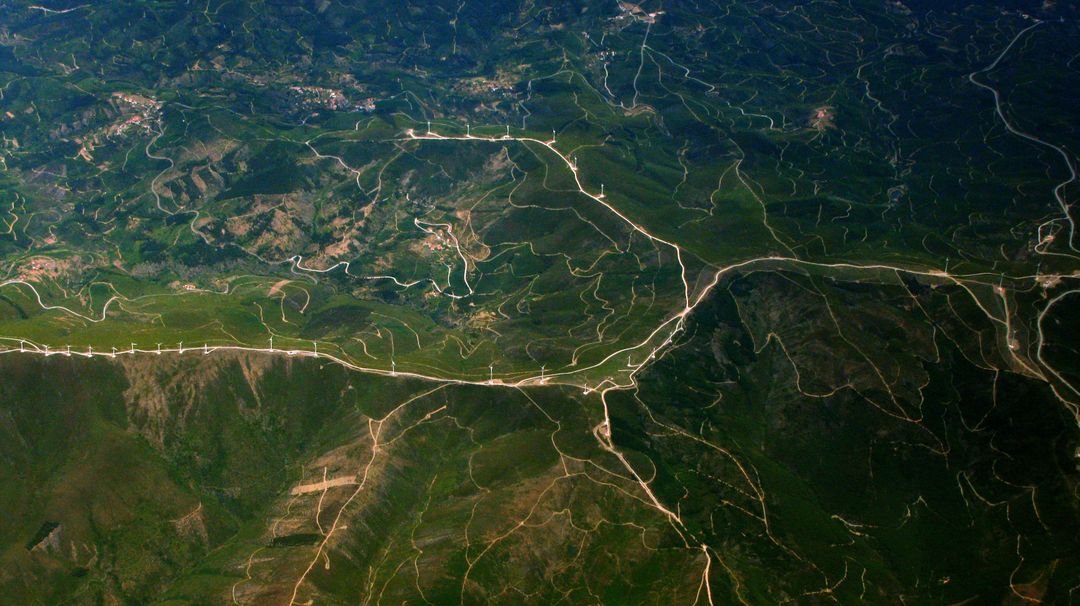 Aerial View of Winding Roads through Mountainous Terrain - Free Images, Stock Photos and Pictures on Pikwizard.com