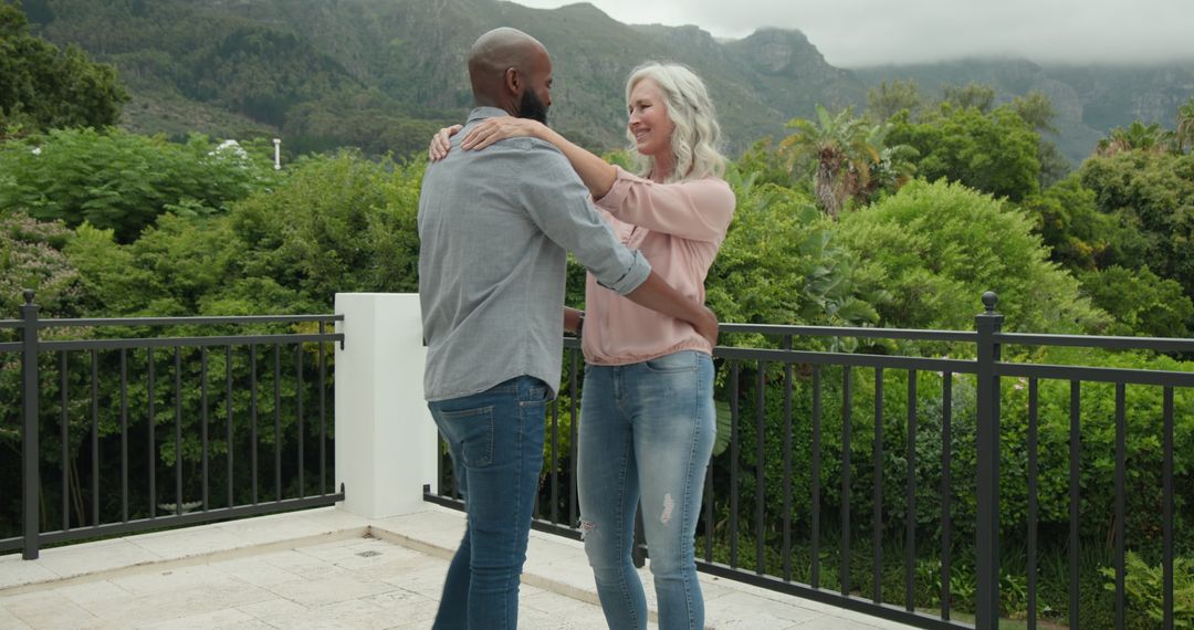 Couple Enjoying Serene Mountain View from Balcony Embracing Nature