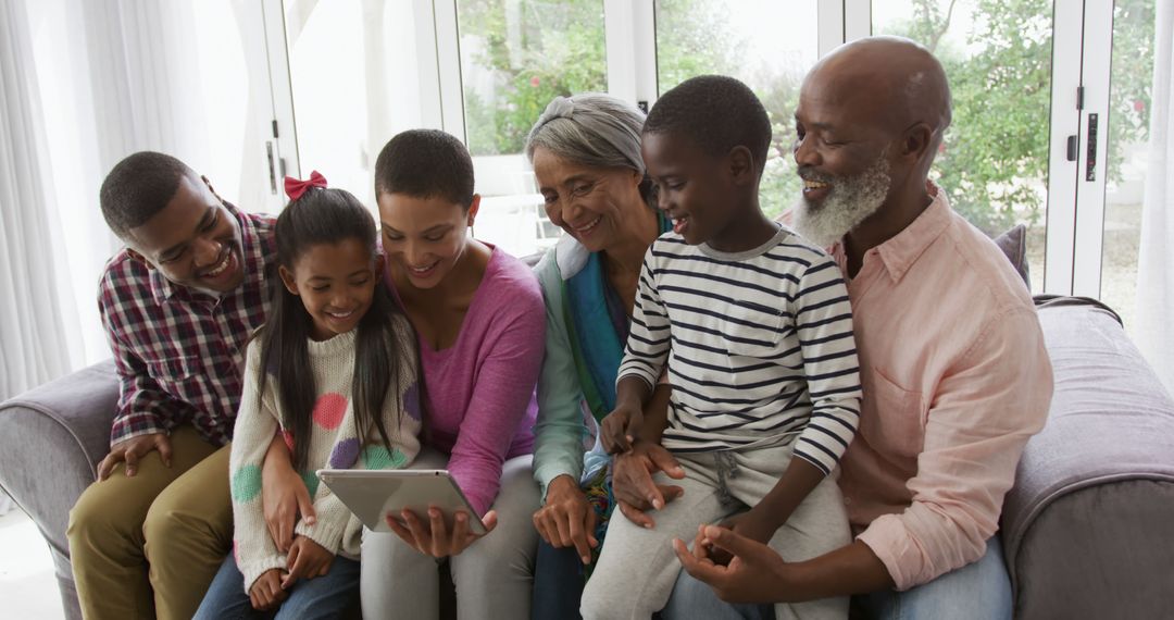 Happy Multigenerational Family Enjoying Tablet at Home