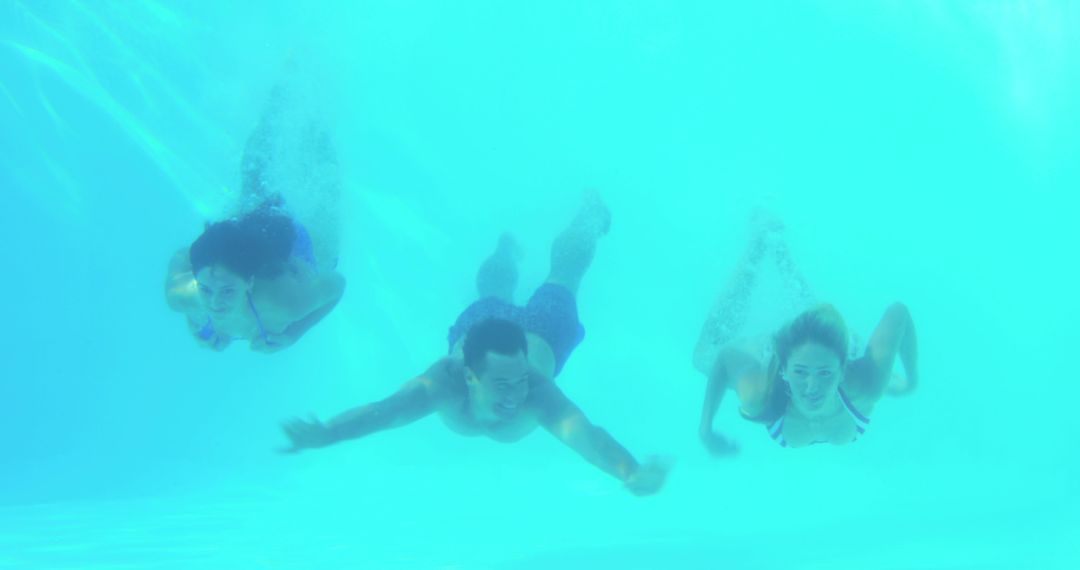 Underwater Group Swimming in Pool - Free Images, Stock Photos and Pictures on Pikwizard.com