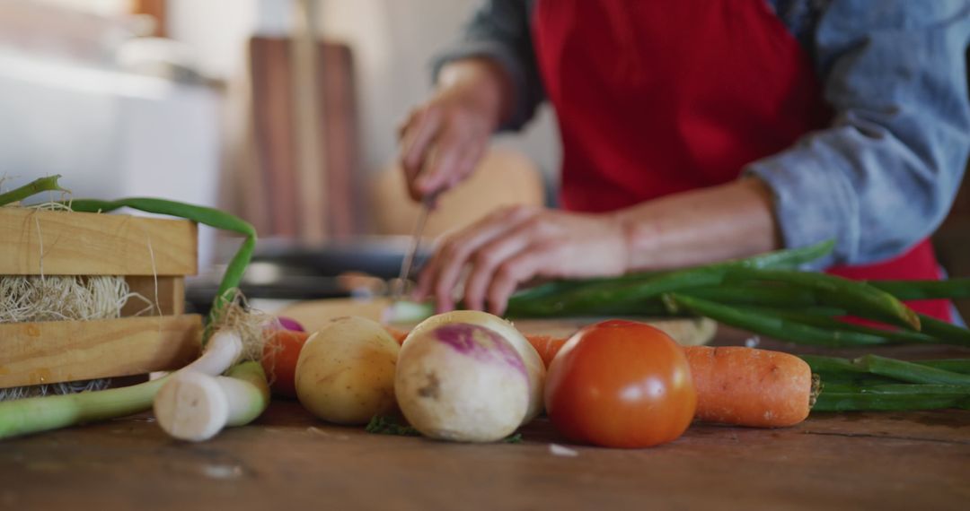 Senior Woman Preparing Fresh Vegetables in Rustic Kitchen