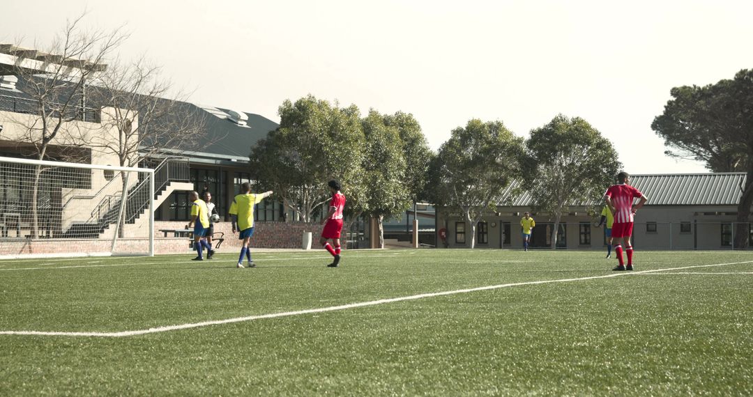 Soccer Players Preparing on Sunny Field for Competitive Match