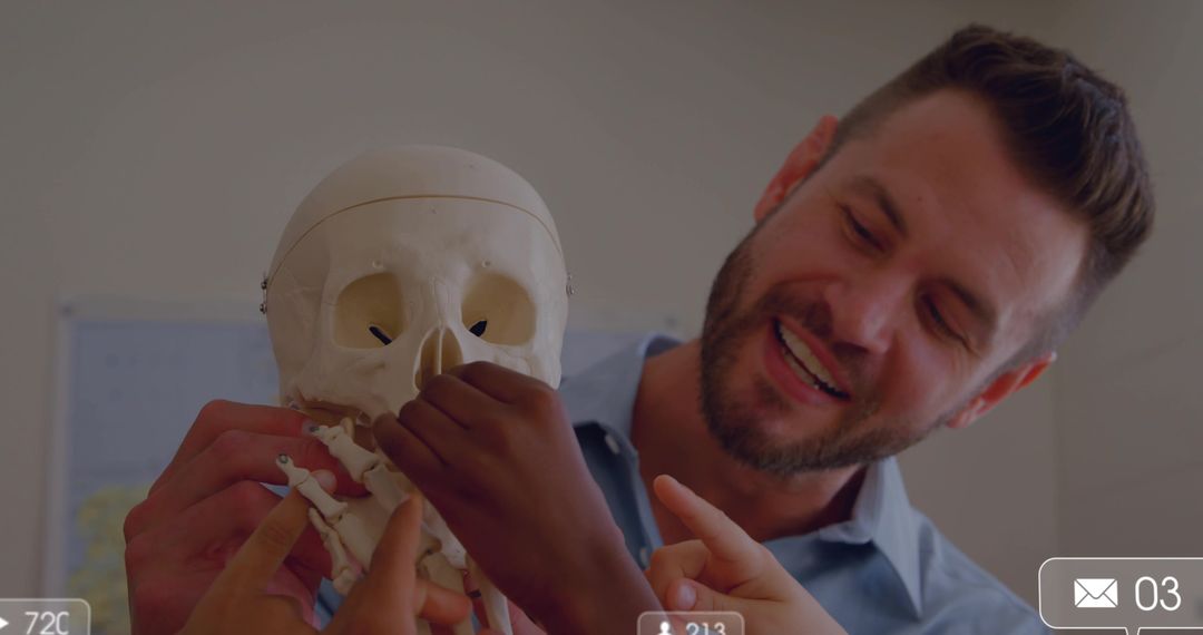 Smiling Teacher Demonstrating Human Skull Model to Students in Hands-on Anatomy Classroom