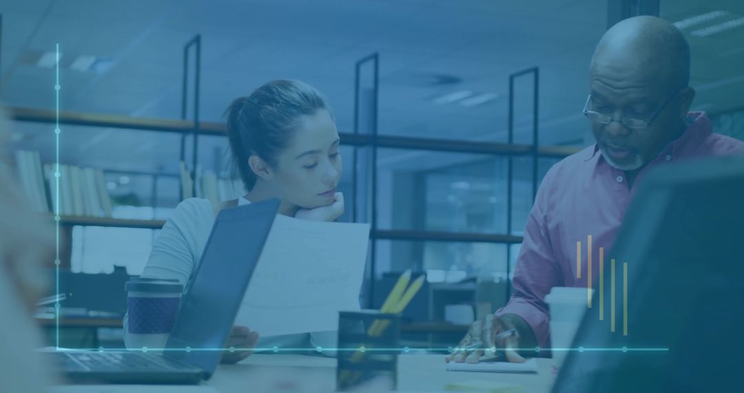 Collaborative Work Meeting in Modern Office, Focus on Mentorship and Teamwork